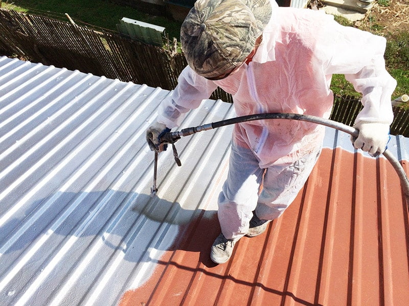 Roof Shield Coating being sprayed on a metal roof.