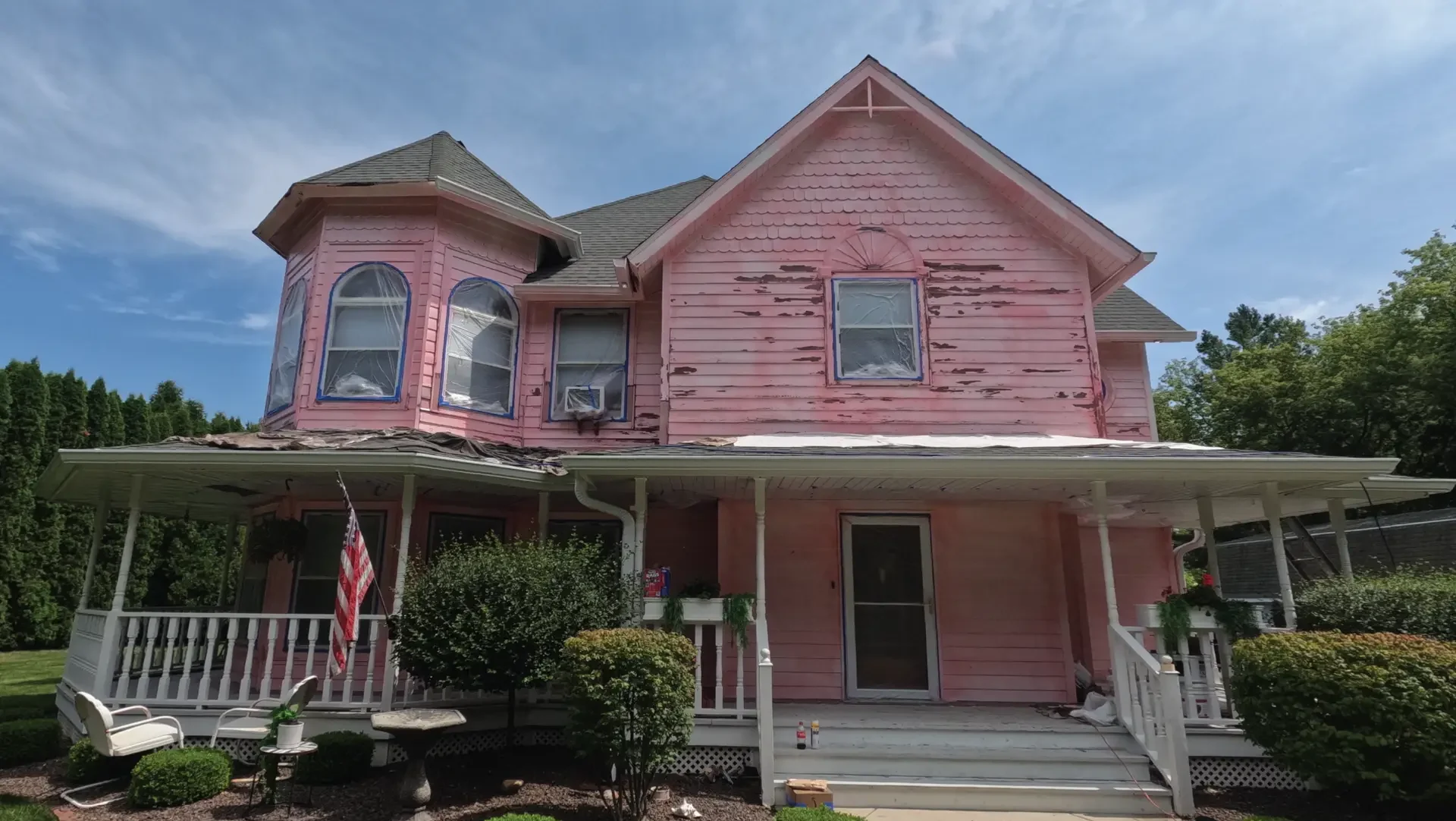 BeforeNikkiKenosha Home Shield Coating Pink Waterproof Bonding Agent Primer on a Cedar House.