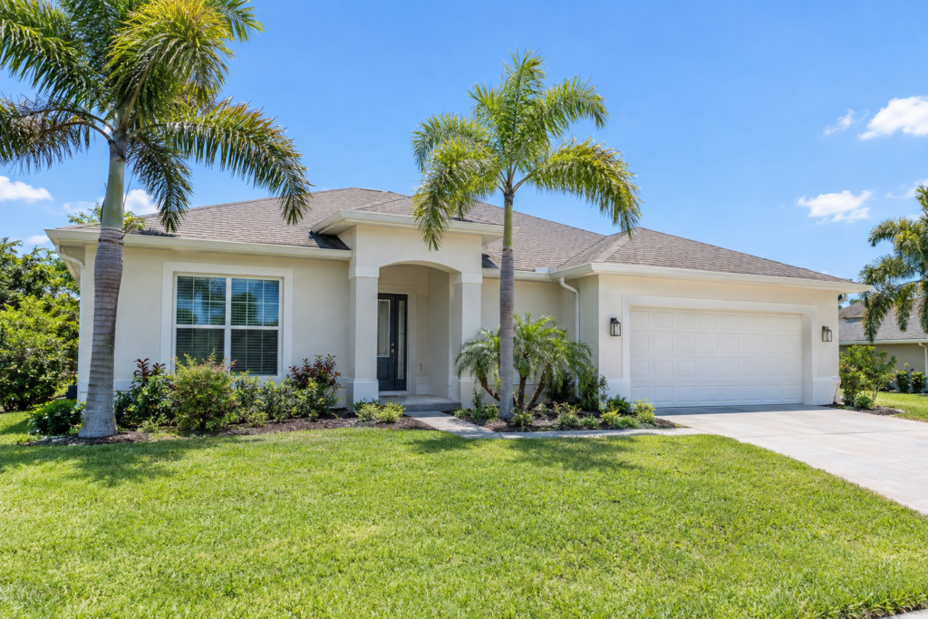 Light off-white stucco home in Central Florida under full sun